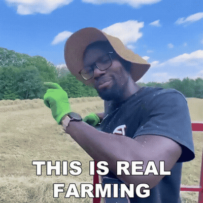 Man In Hat And Green Gloves Farming GIF