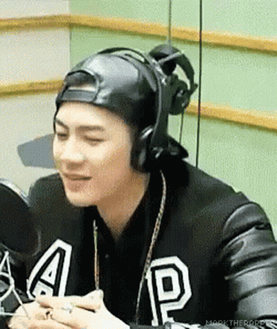 Man In Hat And Headphones At Microphone GIF