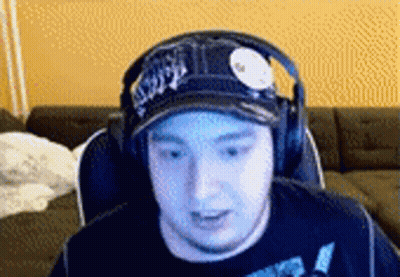 Man In Hat And Headphones Sitting In Chair GIF