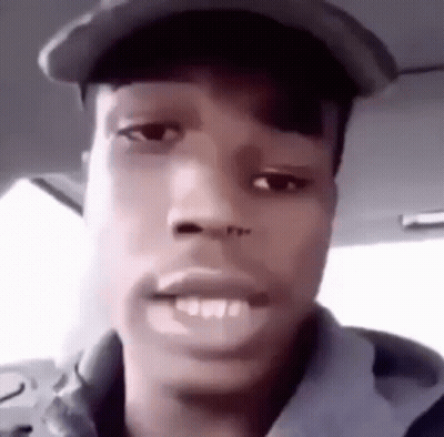Man In Hat And Hoodie Making Funny Face In Car GIF