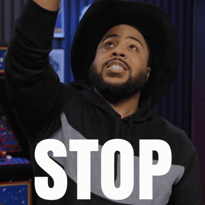 Man In Hat And Hoodie Saying Stop GIF