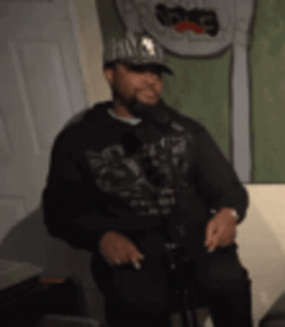 Man In Hat And Hoodie Singing GIF