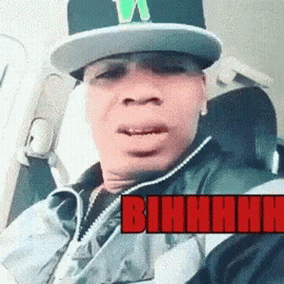 Man In Hat And Jacket In Car With Bihhhh In Red GIF