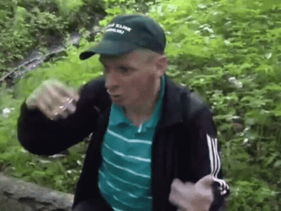 Man In Hat And Jacket In Forest GIF