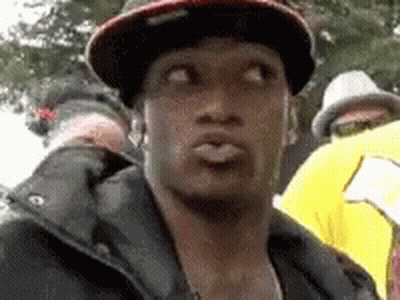 Man In Hat And Jacket Making Face GIF