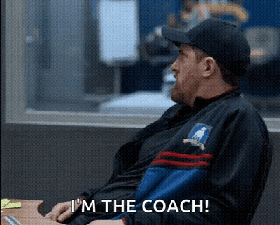 Man In Hat And Jacket Sitting At Desk GIF