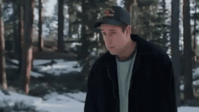 Man In Hat And Jacket Standing In Snowy Forest GIF