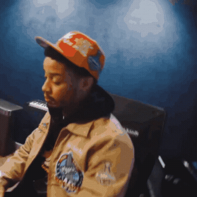 Man In Hat And Jacket With A Patch GIF