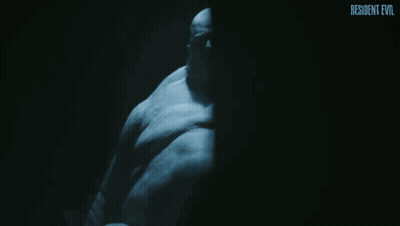 Man In Hat And Jacket With S On Back In Purple Room GIF