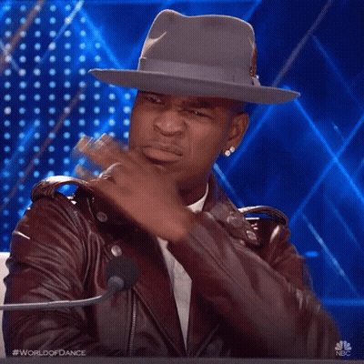 Man In Hat And Leather Jacket At Microphone GIF