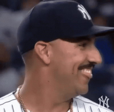 Man in Hat and Mustache Smiling