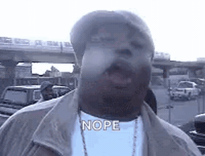 Man In Hat And Necklace Saying Nope GIF