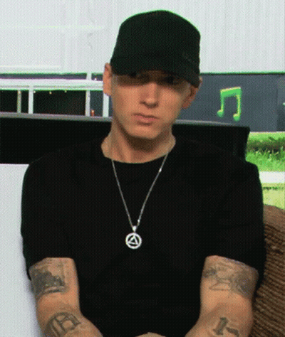 Man In Hat And Necklace With R Tattoo GIF