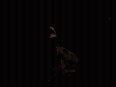 Man In Hat And Pink Shirt Talking Into 98.7 FM Microphone GIF