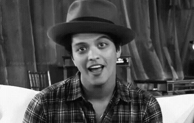 Man In Hat And Plaid Shirt Sitting On Couch GIF