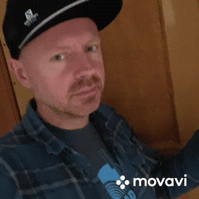 Man In Hat And Plaid Shirt With Movado GIF