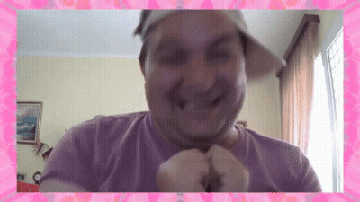 Man In Hat And Purple Shirt Smiling With Pink Frame GIF