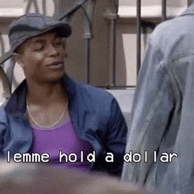 Man In Hat And Purple Shirt Talking To Another Man Holding Dollar GIF