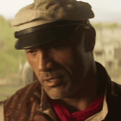 Man In Hat And Red Scarf Looking At Camera GIF