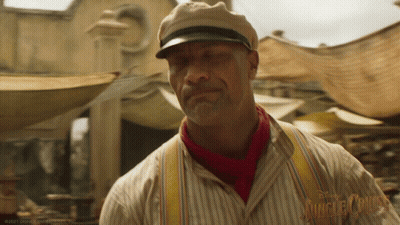 Man In Hat And Scarf At Jungle Cruise Sign GIF