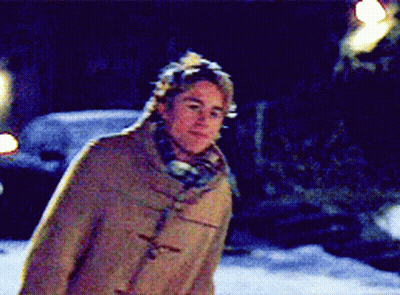 Man In Hat And Scarf Standing In Snow GIF