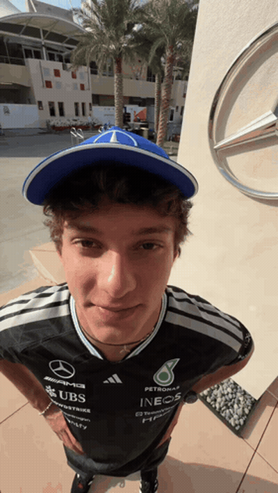 Man In Hat And Shirt Saying UBS And INEOS GIF