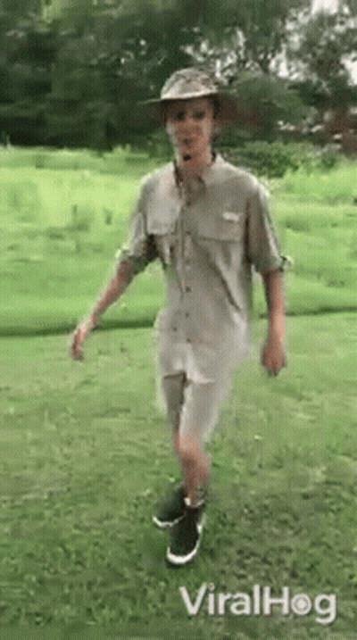Man In Hat And Shorts Standing On One Leg GIF