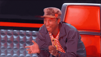 Man In Hat And Striped Shirt Sitting In Red Chair GIF