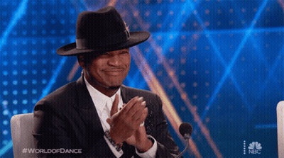 Man In Hat And Suit Clapping At Microphone World Of Dance GIF