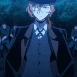 Man In Hat And Suit Standing In Front Of Group GIF