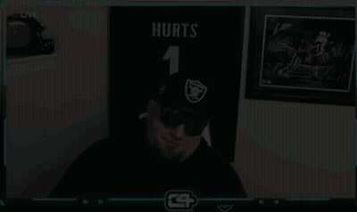 Man In Hat And Sunglasses Beside Football Wall GIF