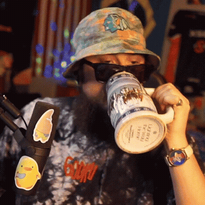 Man In Hat And Sunglasses Drinking Leprechaun Mug GIF