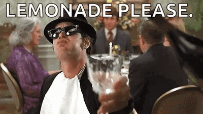 Man In Hat And Sunglasses Holding Lemonade At Table GIF