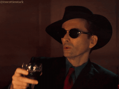 Man In Hat And Sunglasses Holding Wine Glass Saying Shades Of Dark Gray GIF