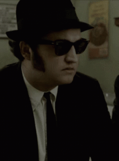 Man In Hat And Sunglasses Looking GIF