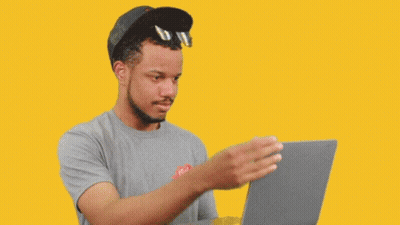 Man In Hat And Sunglasses Looking At Laptop GIF