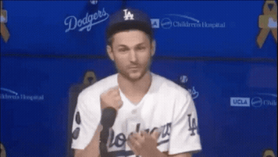 Man In Hat And Sunglasses Sitting In Stadium GIF