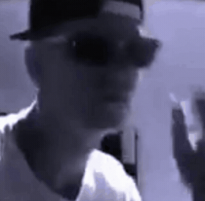 Man In Hat And Sunglasses Smoking Cigarette GIF