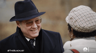 Man In Hat And Sunglasses Talking To Woman In Hat GIF