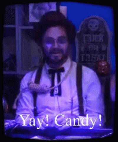 Man In Hat And Suspenders Says Yay Candy GIF