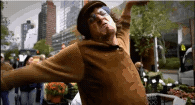 Man In Hat And Sweater Dancing In Crowd GIF