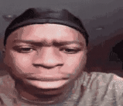 Man In Hat And T-Shirt Making Funny Face GIF