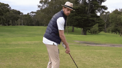 Man In Hat And Vest Holding Golf Club GIF