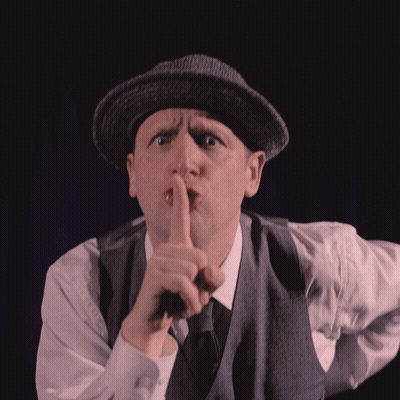 Man In Hat And Vest Shushing GIF