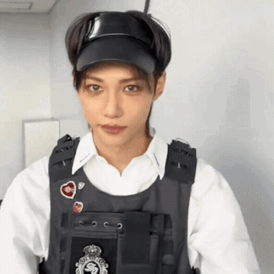 Man In Hat And Vest Standing GIF