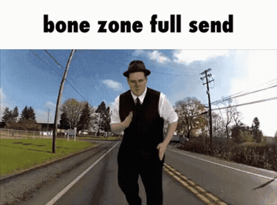 Man In Hat And Vest Walking Down Road Bone Zone Full Send GIF