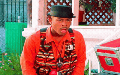 Man In Hat And Vest With Sticker Saying A GIF