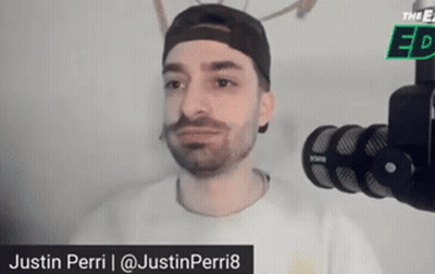 Man In Hat And White Shirt At Microphone GIF