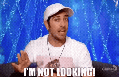 Man In Hat And White Shirt Says I'm Not Looking GIF