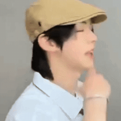 Man In Hat And White Shirt Shushing GIF